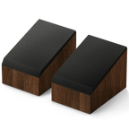 KEF Q8 Meta Dolby Atmos speakers showing sleek black speaker units with metal grilles and branding in a modern home setting.