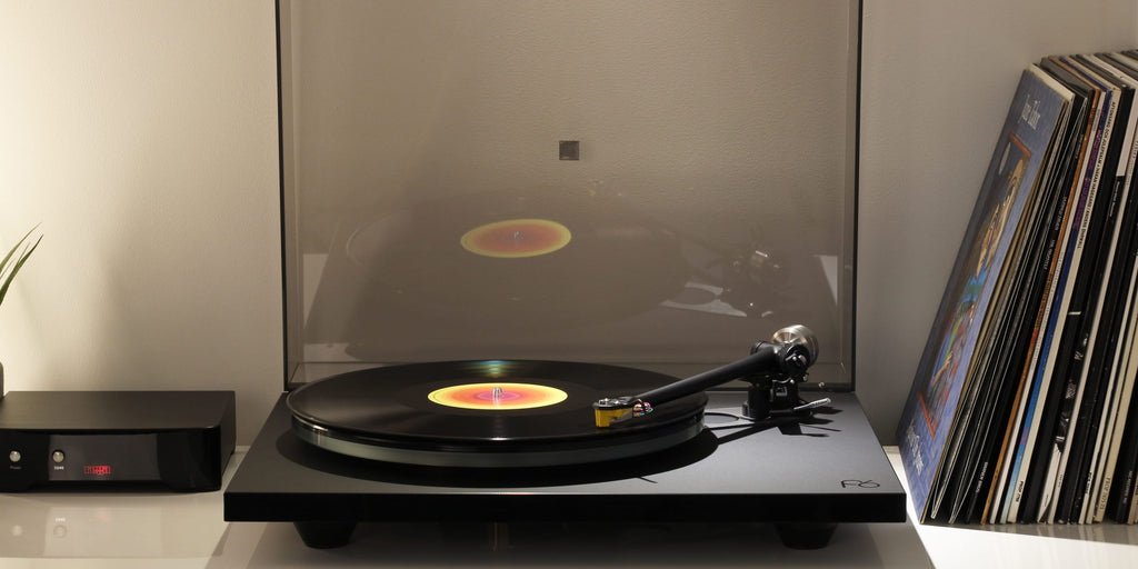 Rega Planar 6 turntable in Polaris Grey with Nd5 cartridge, showcasing the sleek design and tonearm details.
