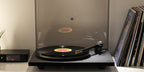 Rega Planar 6 turntable in Polaris Grey with Nd5 cartridge, showcasing the sleek design and tonearm details.