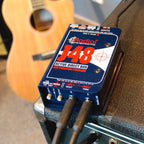 Radial Engineering J48 mono DI box with rugged metal casing and input/output connections for professional audio signal management.