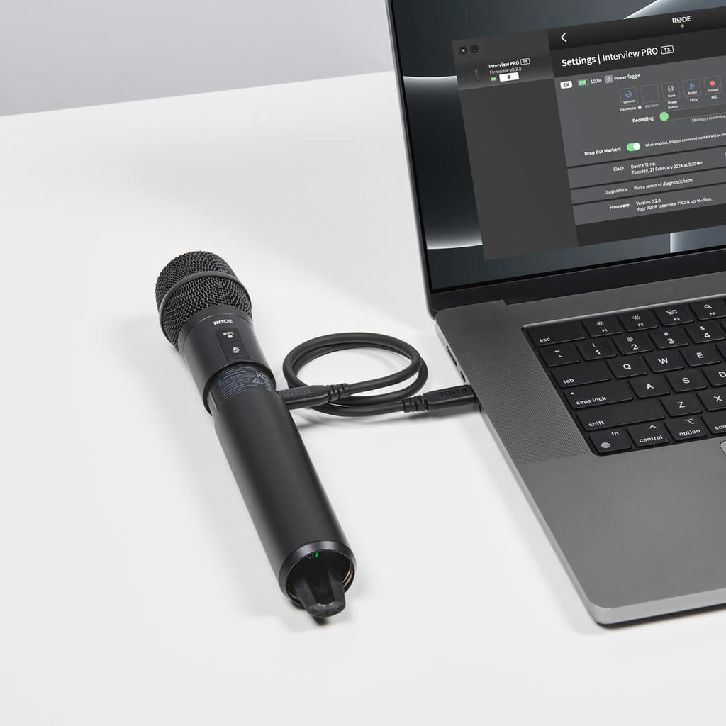Rode Interview Pro wireless microphone accessory connected to laptop, showing user guide and setup details.