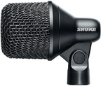 Shure Nexadyne 2 dynamic microphone shown in a close-up, highlighting its black body and grille design.