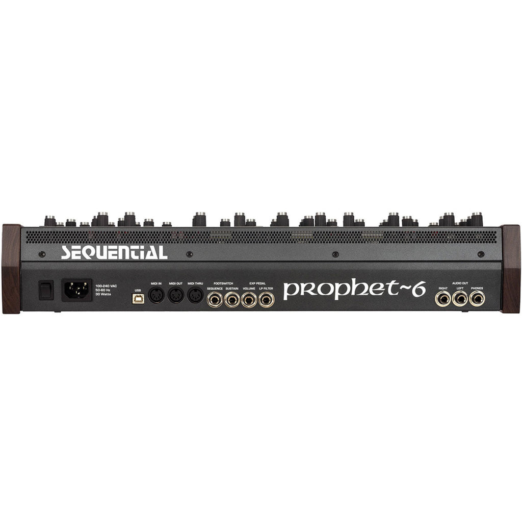 Sequential Prophet-6 Desktop synthesizer shown with its front panel, featuring knobs and controls on a sleek black surface.