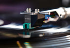 Sumiko Olympia MM phono cartridge installed on Technics 1200 turntable, showing detailed view of cartridge and stylus.