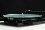 Pro-Ject T1 EVO turntable showing the speed switch for selecting 33 or 45 RPM playback.
