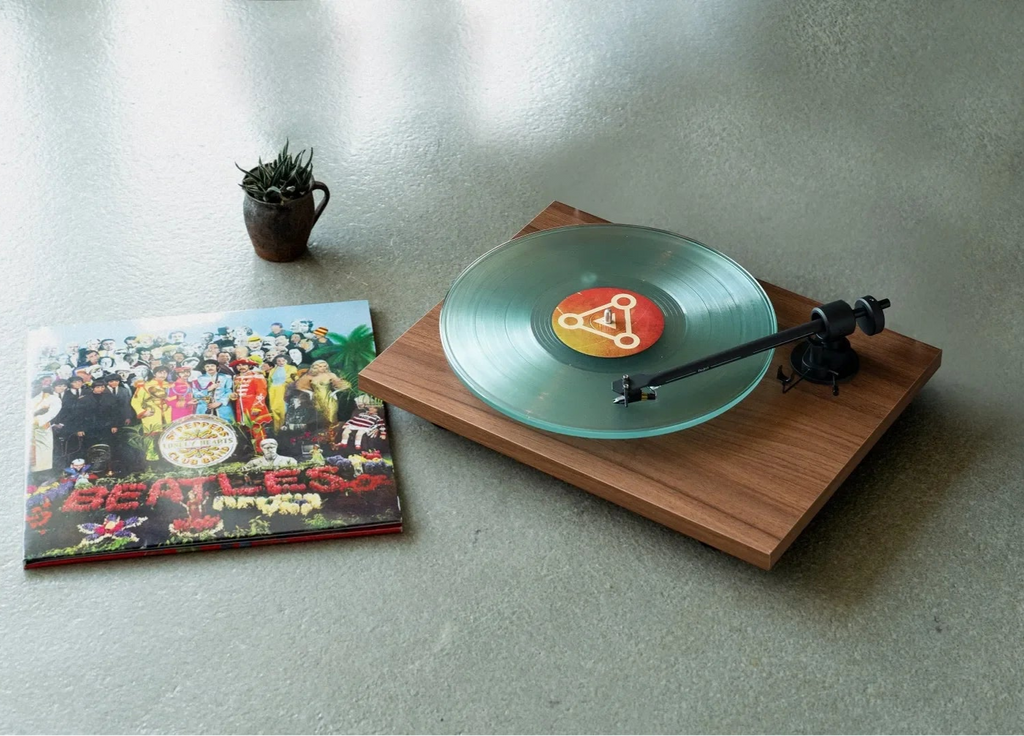 Pro-Ject T1 EVO turntable with black plinth, tonearm, and platter, showcasing sleek design and high-quality audio components.