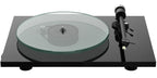 Pro-Ject T2 W turntable with wood finish and sleek design, featuring tonearm and platter for high-quality vinyl playback.