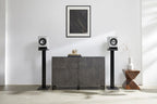 Technics SC-CX700 active bookshelf speakers in gray with volume and bass controls, designed for high-quality audio.