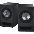 Technics SC-CX700 active bookshelf speakers with sleek black finish and modern design, showcasing their compact, stylish audio setup.