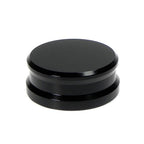 Black Tonar record weight stabilizer with 45 adaptor for vinyl records, enhances sound quality and reduces vibrations.