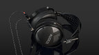 Audeze LCD-XC Creator Package studio headphones with leather-free ear cushions, black and silver design, on a neutral background.