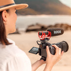Rode VideoMic NTG camera microphone mounted on a camera, showing its compact design and built-in shock mount.