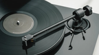 Pro-Ject E1.2 turntable with sleek design, featuring a wooden plinth and tonearm for high-quality vinyl playback.