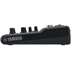 Yamaha MG06 analog mixer with two channels, knobs, and input jacks for audio mixing and sound control.