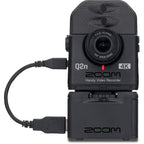Zoom Q2n-4K video camera in protective case, showcasing compact design and lens for high-quality audio and video recording.